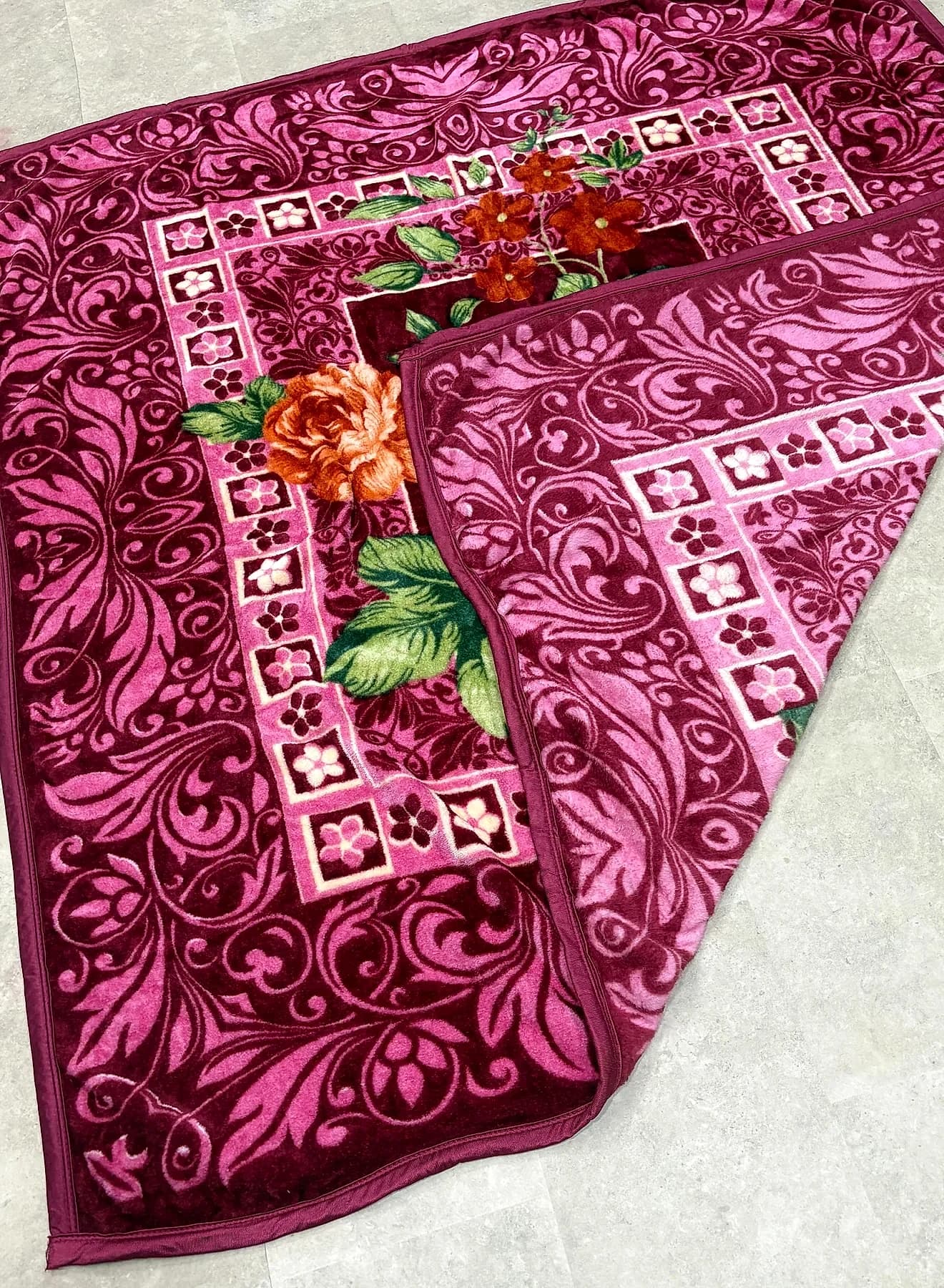 Deep wine floral embossed mink blanket showing rich plush pile and ornate border