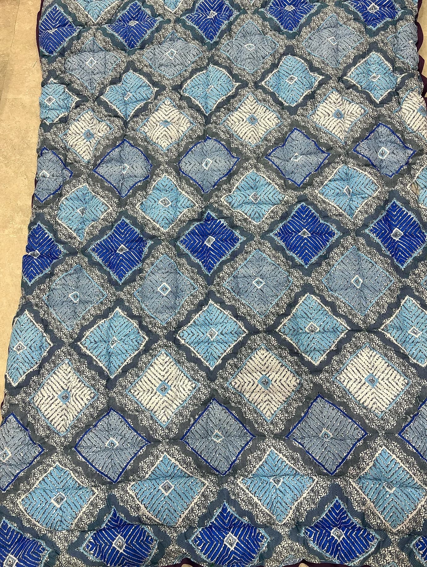 Royal blue and indigo geometric diamond ikat print quilted razai