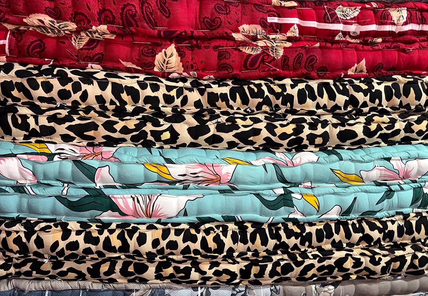Assorted seasonal batch mattress stacks in Ratlam workshop